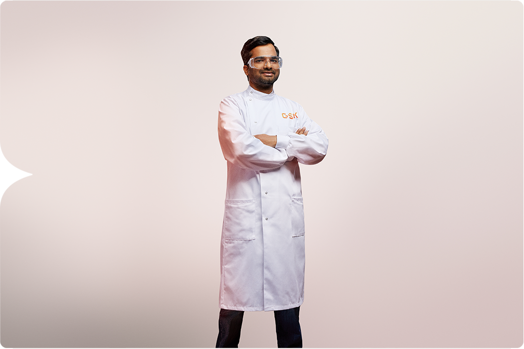 Photograph of a doctor standing in a lab coat, modified asthma inhaler, lower carbon footprint, GSK 220735 Study.